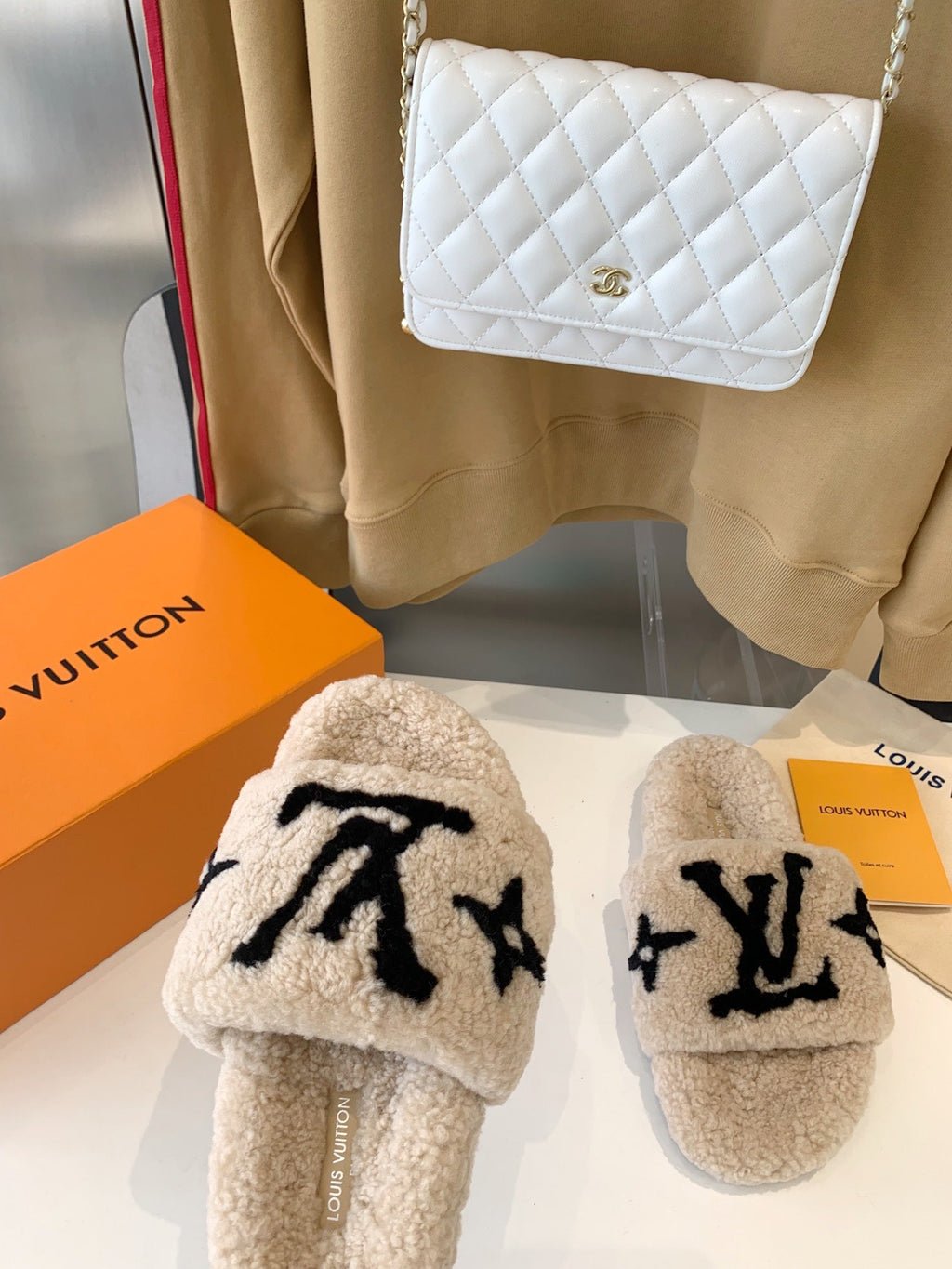 LV WOMEN'S PASEO FLAT SLIPPER IN TAN BROWN FLEECE WITH BLACK LOGO