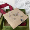 GUCCI 26S DOUBLE G LOGO PINK STONE MULTI CHARM BRACELET IN SILVER TONE METAL