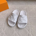 LV EMBOSSED POOL PILLOW SANDALS IN WHITE RUBBER