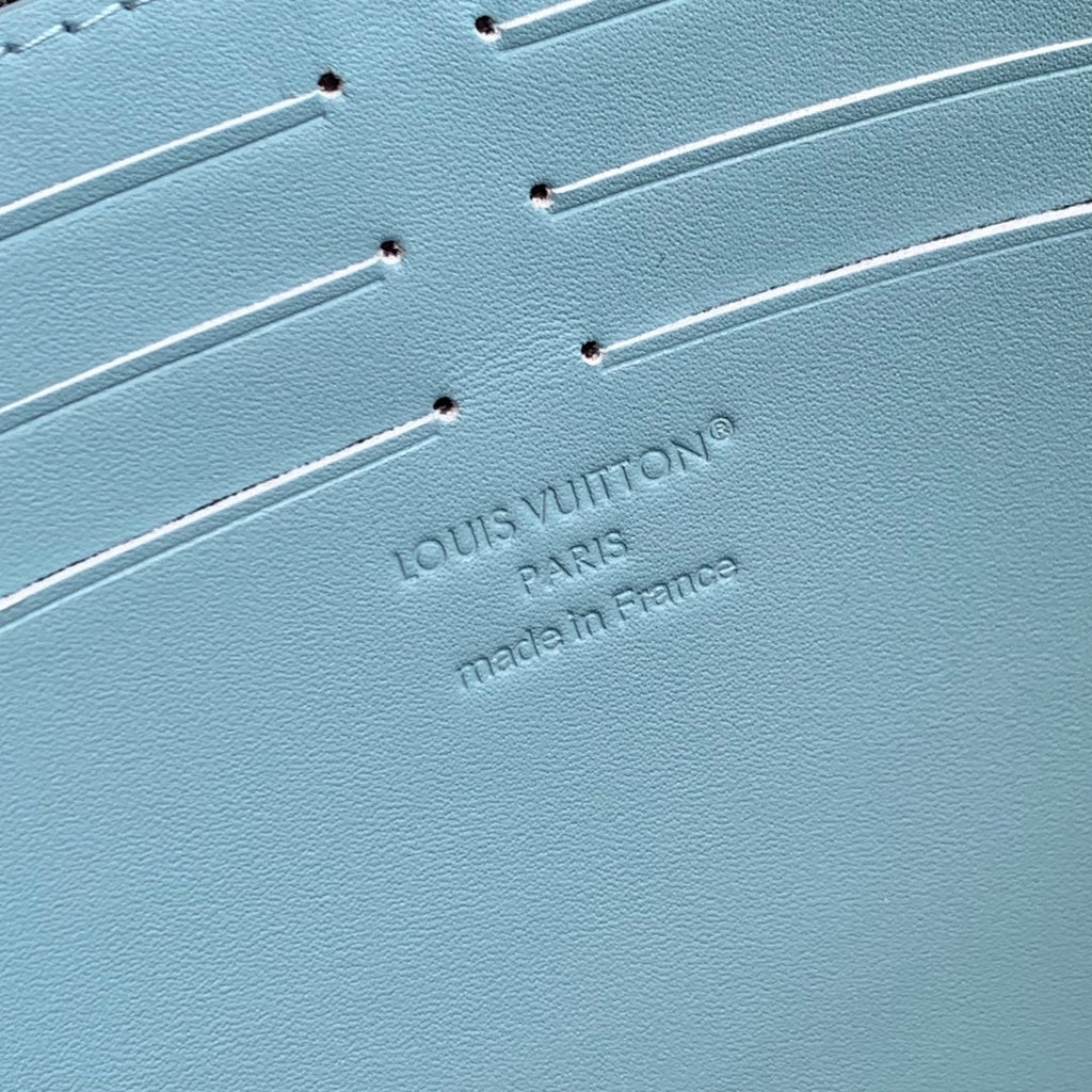 POCHETTE VOYAGE 26 IN SKY BLUE MONOGRAM ECLIPSE CALFSKIN