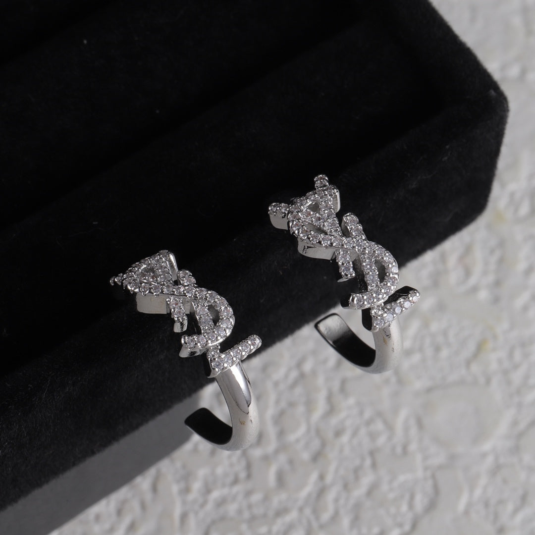 YSL 26S CRYSTAL LOGO HOOP EARRINGS IN SILVER TONE METAL 629139