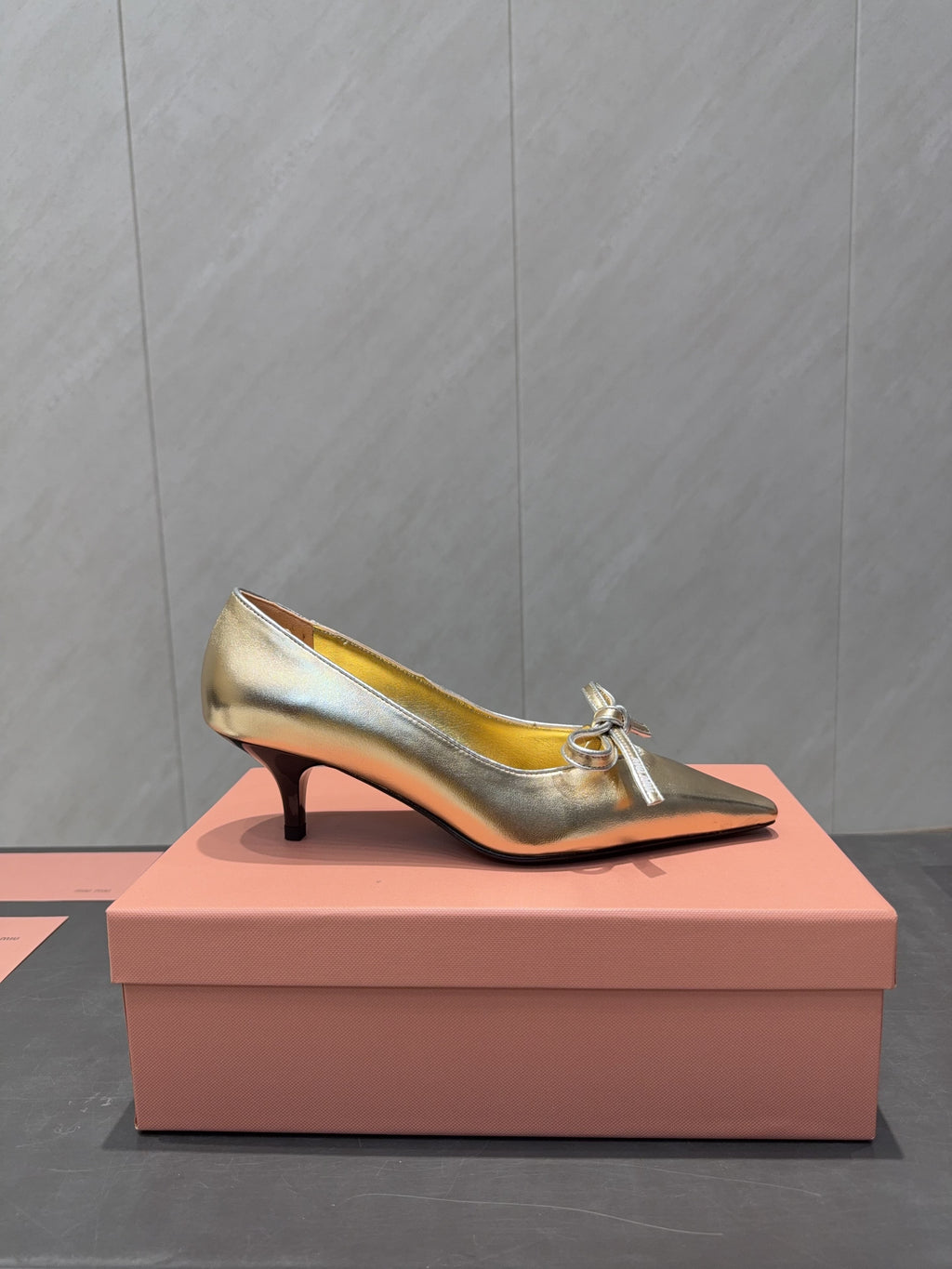 MIUMIU 26S POINTED TOE PUMPS 55MM IN GOLD CALFSKIN WITH BOW