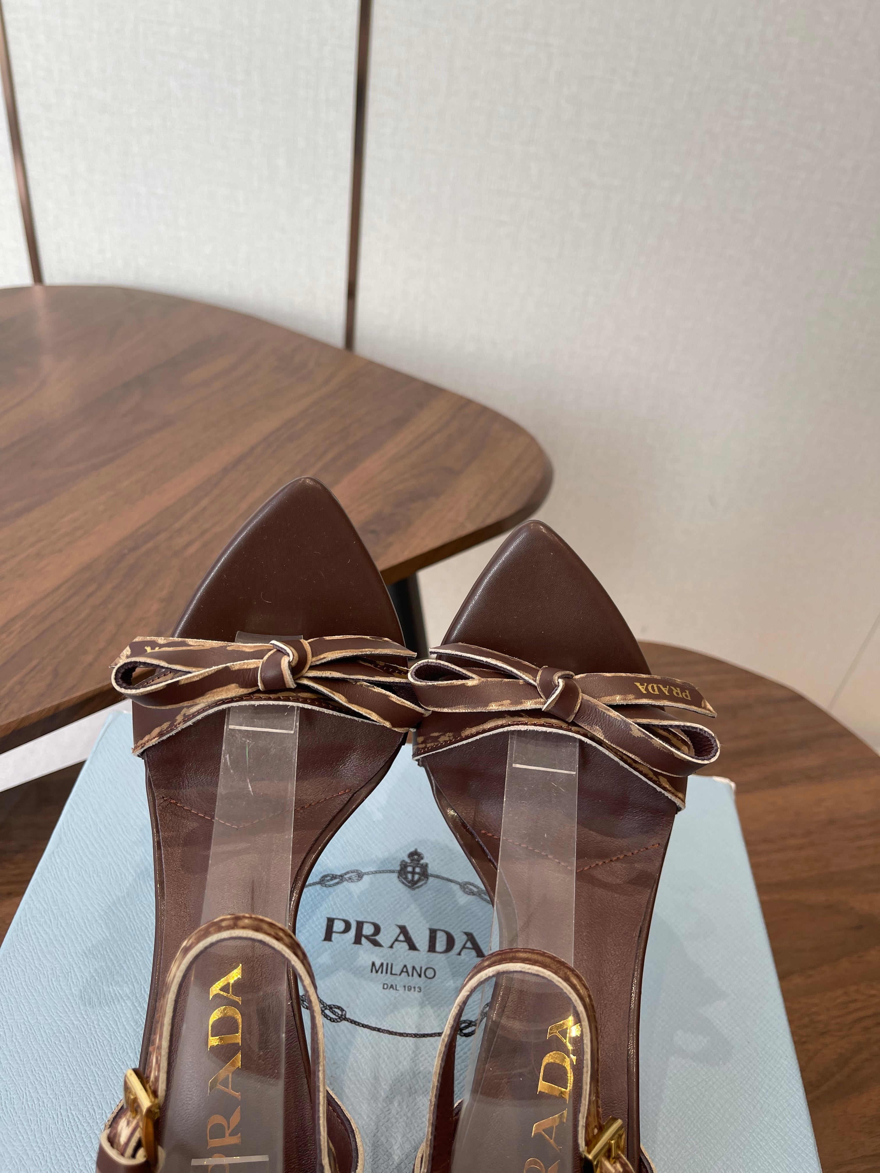 PRADA 26S HIGH HEEL SANDALS 85MM IN CHOCOLATE BROWN CALFSKIN WITH BOW