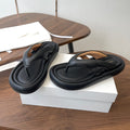 THE ROW 26S PUFFED THONG SANDALS IN BLACK CALFSKIN