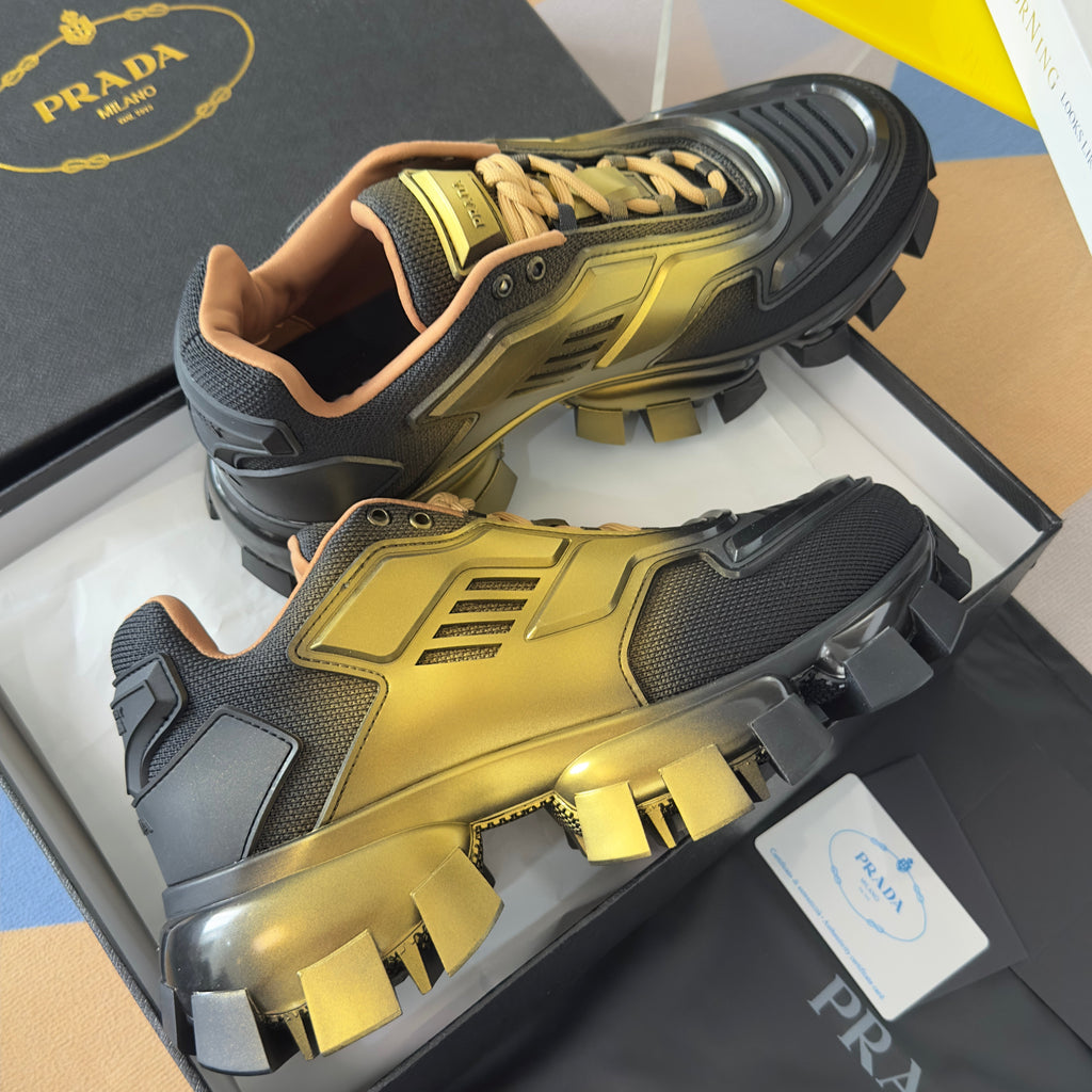 PRADA 26S CLOUDBUST THUNDER SNEAKERS 60MM IN BLACK AND GOLD MESH FABRIC AND TPU