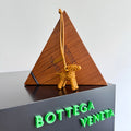 BOTTEGA VENETA 25S DOG CHARM IN BURNT ORANGE CALFSKIN
