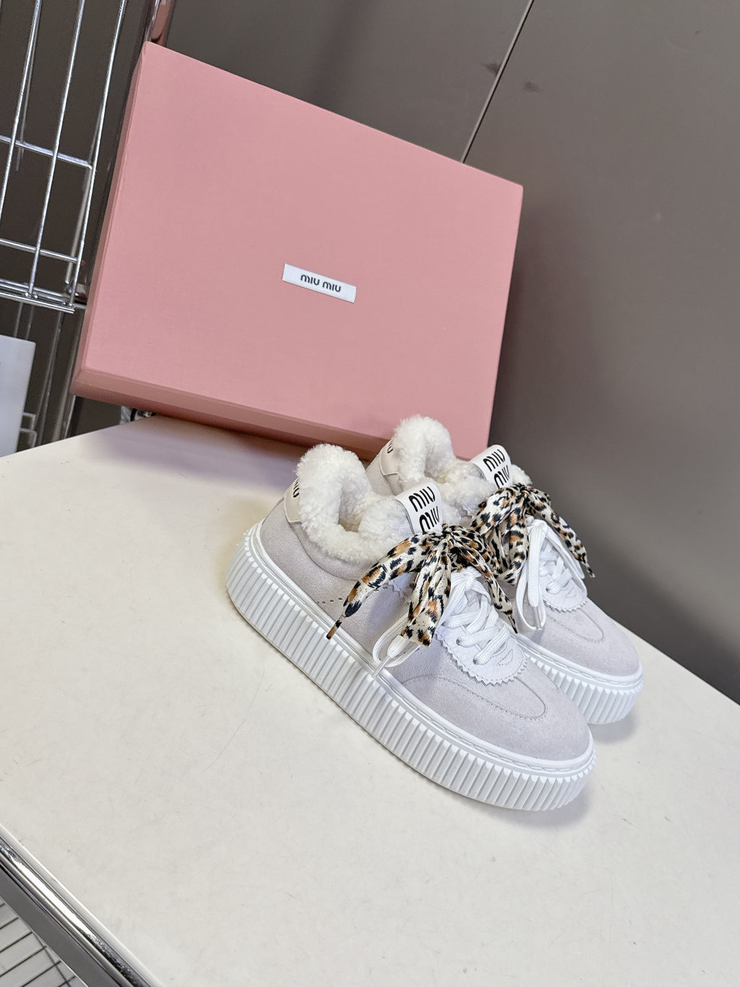 MIUMIU 25S SNEAKERS 45MM IN WHITE SUEDE WITH LEOPARD-PRINT LACES SHEARLING