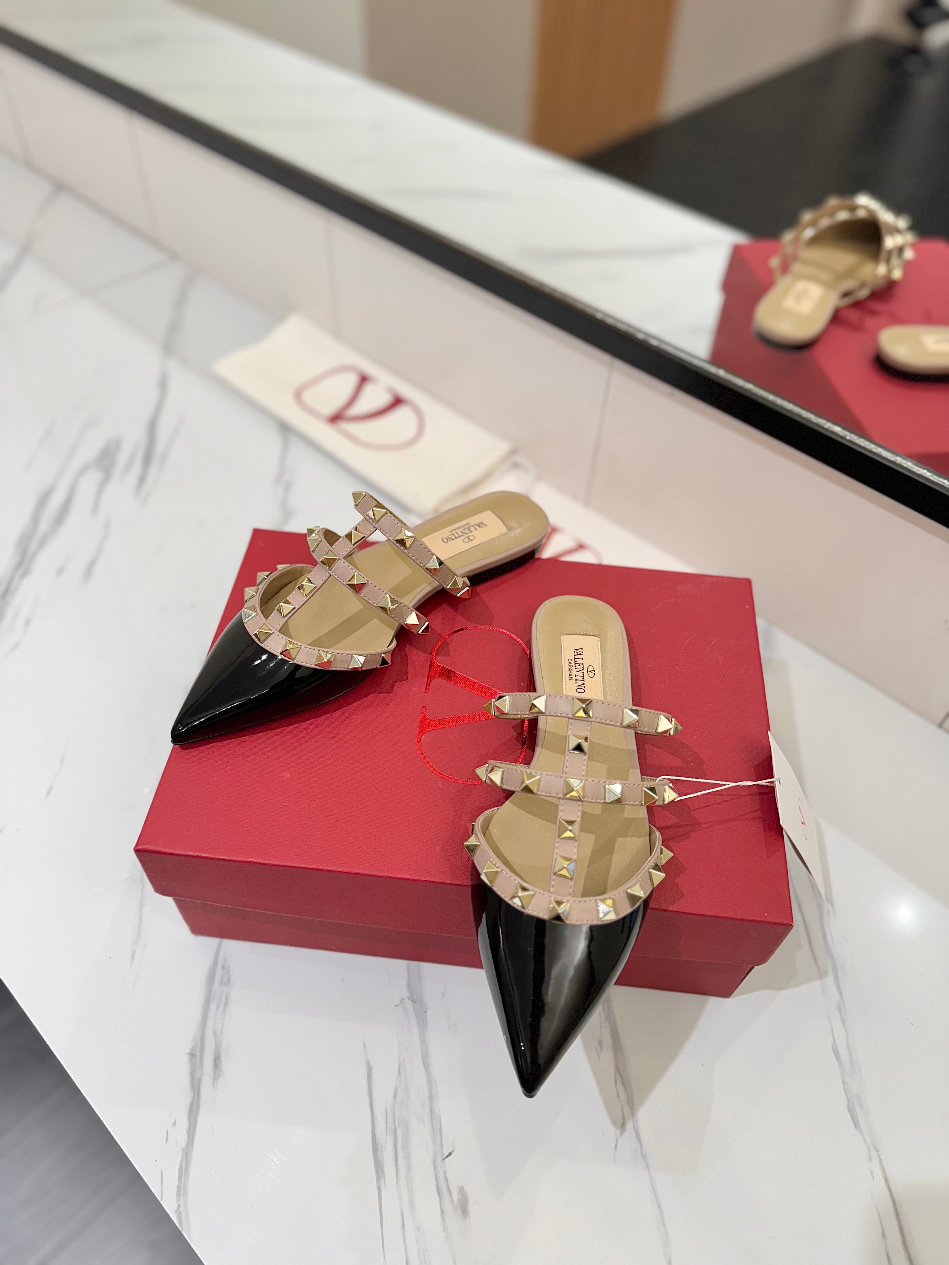 VALENTINO 26S STUDDED FLAT MULES IN BLACK PATENT CALFSKIN