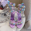 RENE CAOVILLA 26S HEEL SANDALS 95 MM IN METALLIC PURPLE LAMBSKIN CRYSTAL FLOWER EMBELLISHMENTS