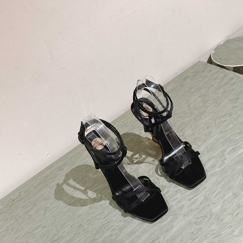 YSL 25S HIGH-HEEL SANDALS 100 MM IN BLACK SATIN WITH YSL LOGO HEEL DESIGN IN GOLD