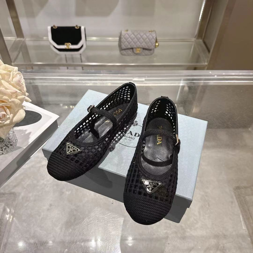 PRADA 26S LOGO PLAQUE MARY JANE FLATS IN BLACK WOVEN FIBER