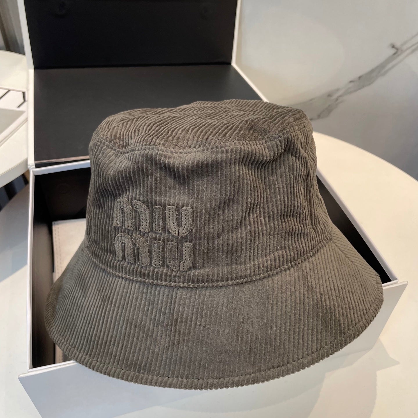 MIUMIU BUCKET IN MUTED BROWN VELVET WITH LOGO