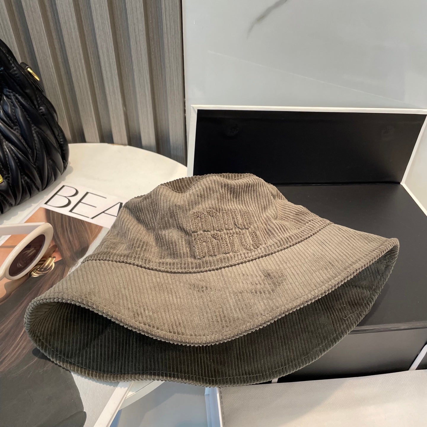MIUMIU BUCKET IN MUTED BROWN VELVET WITH LOGO
