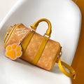 KEEPALL BANDOULIÈRE 25 IN ORANGE MONOGRAM HERITAGE CANVAS