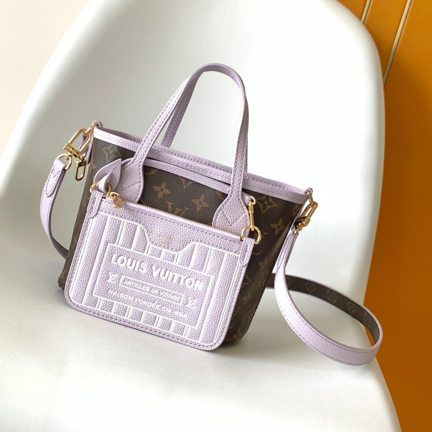 LV 25S NEVERFULL BANDOULIÈRE INSIDE OUT BB 24 IN LIGHT PURPLE AND BROWN CALFSKIN