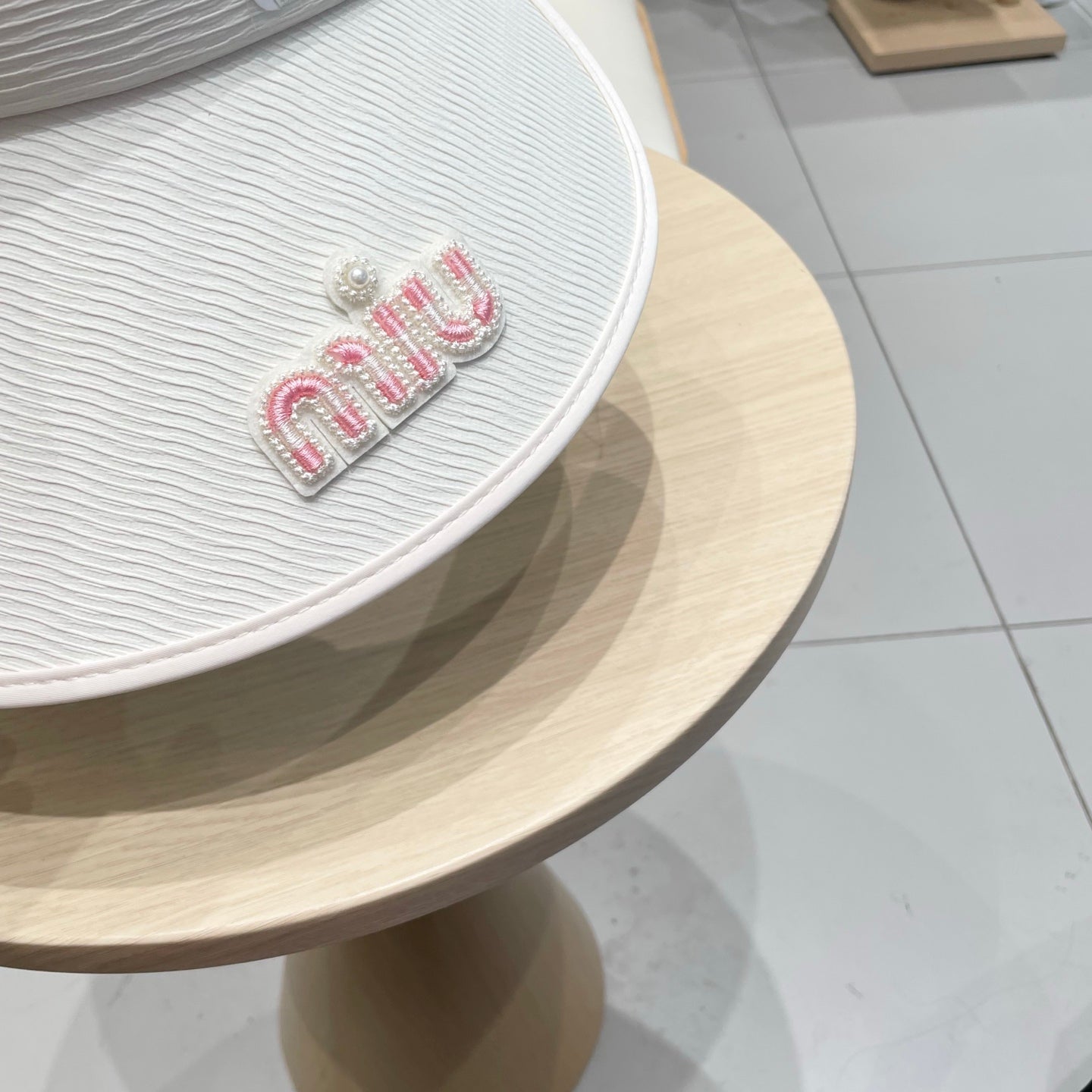 MIUMIU FASHION VISOR CAP IN BLACK AND WHITE WITH LOGO TEXT EMBROIDERY