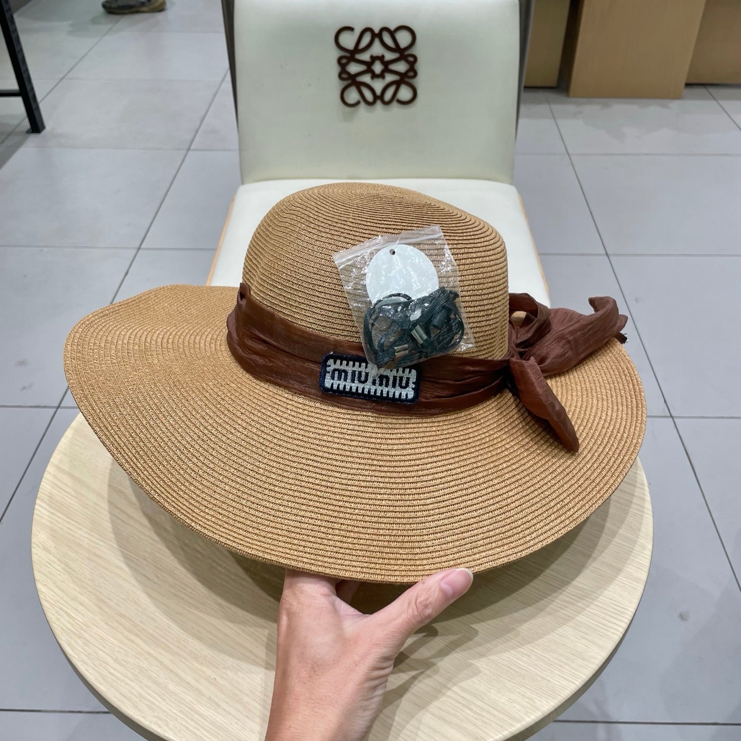 MIUMIU WIDE-BRIM BEACH HAT IN BEIGE WITH FABRIC BOW