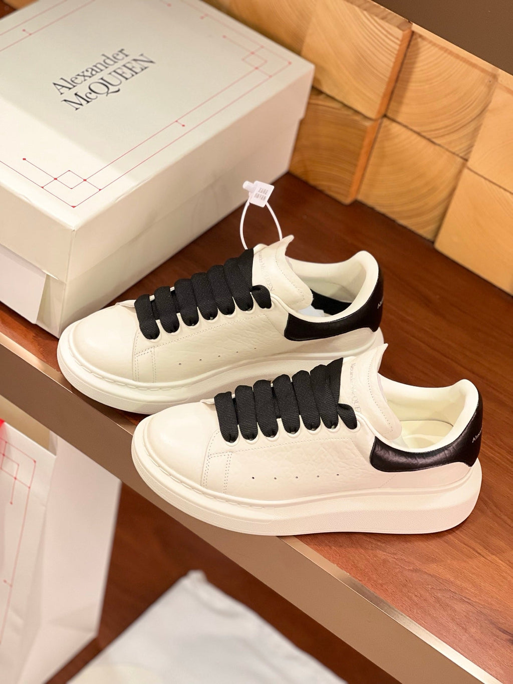 OVERSIZED SNEAKERS IN WHITE CALFSKIN BLACK HEEL BLACK LACES