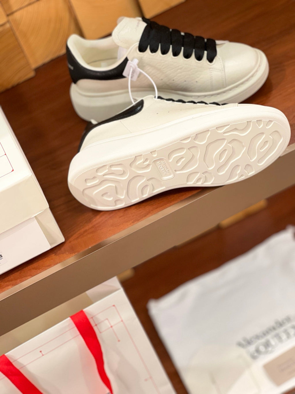 OVERSIZED SNEAKERS IN WHITE CALFSKIN BLACK HEEL BLACK LACES