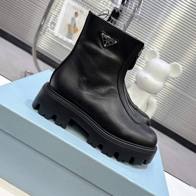 PRADA 25S ZIP-UP ANKLE BOOTS IN BLACK CALFSKIN
