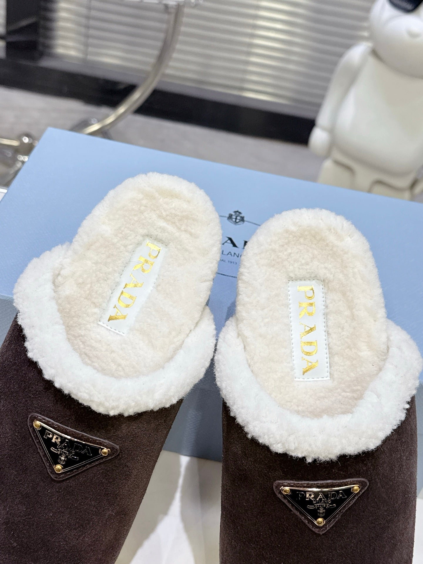 PRADA 25S FUR-LINED MULES IN DARK BROWN SUEDE