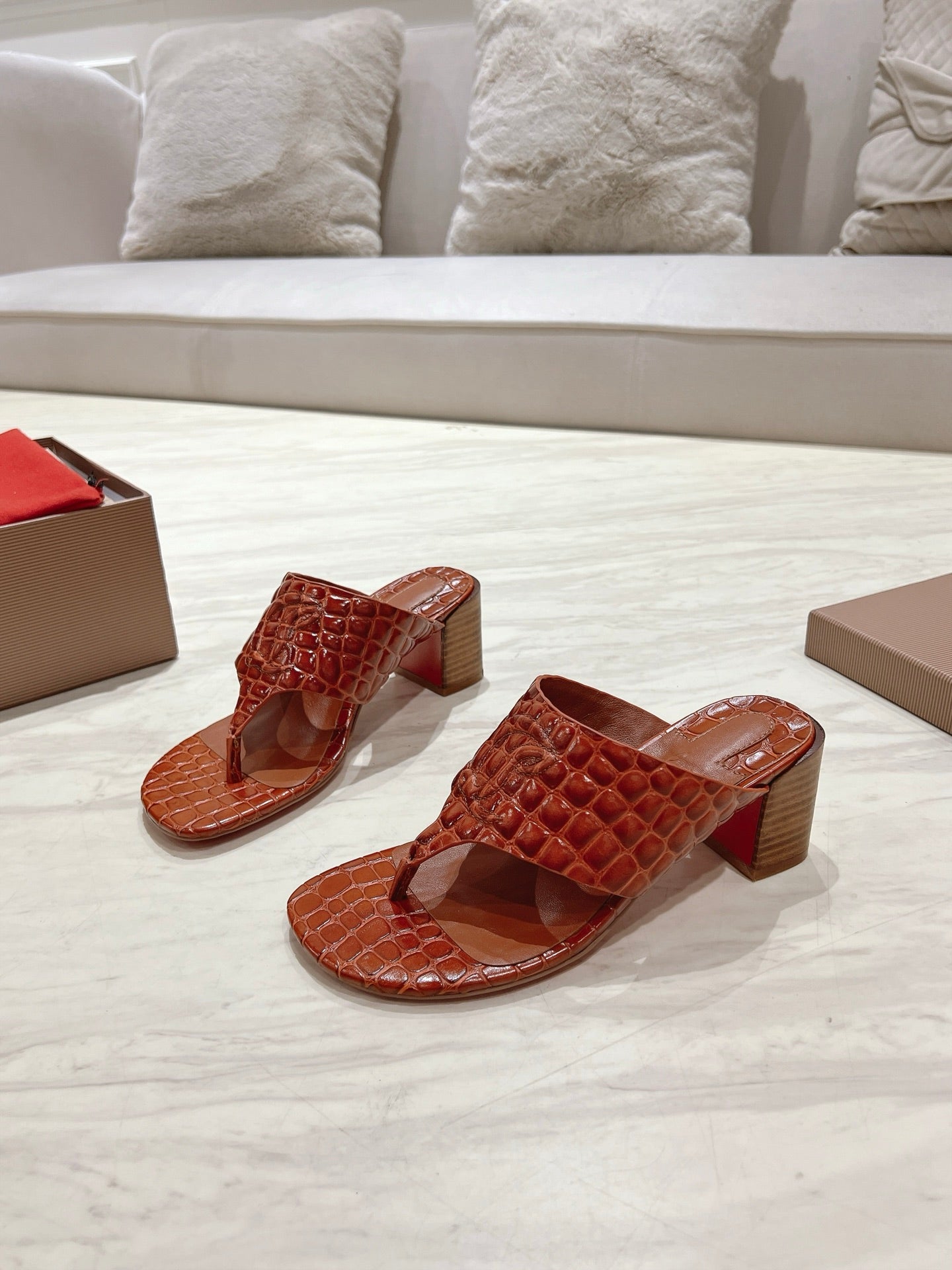 EMBOIDERED LOGO MULES IN COGNAC BROWN EMBOSSED CALFSKIN