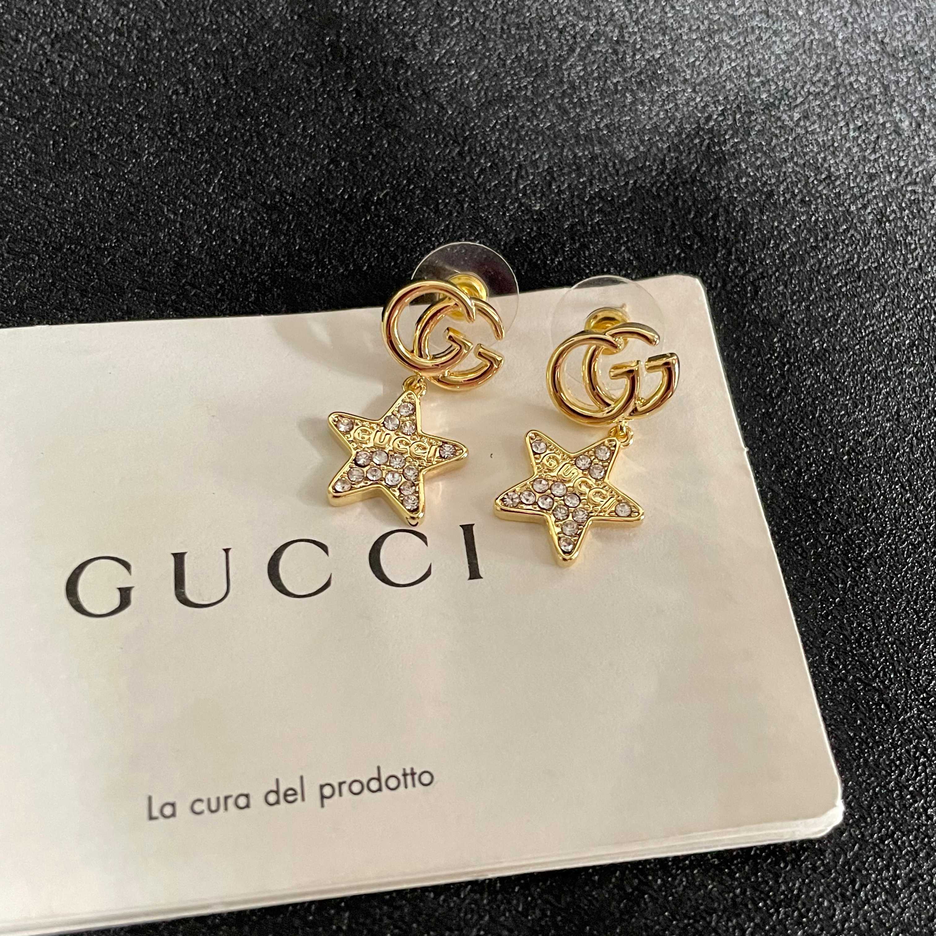GUCCI 26S DOUBLE G STAR CRYSTAL DROP EARRINGS IN GOLD TONE METAL 627015