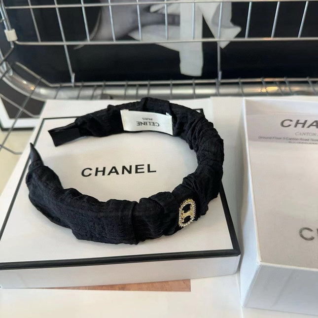 BLACK FABRIC WITH GOLD LOGO HAIRBAND 414448