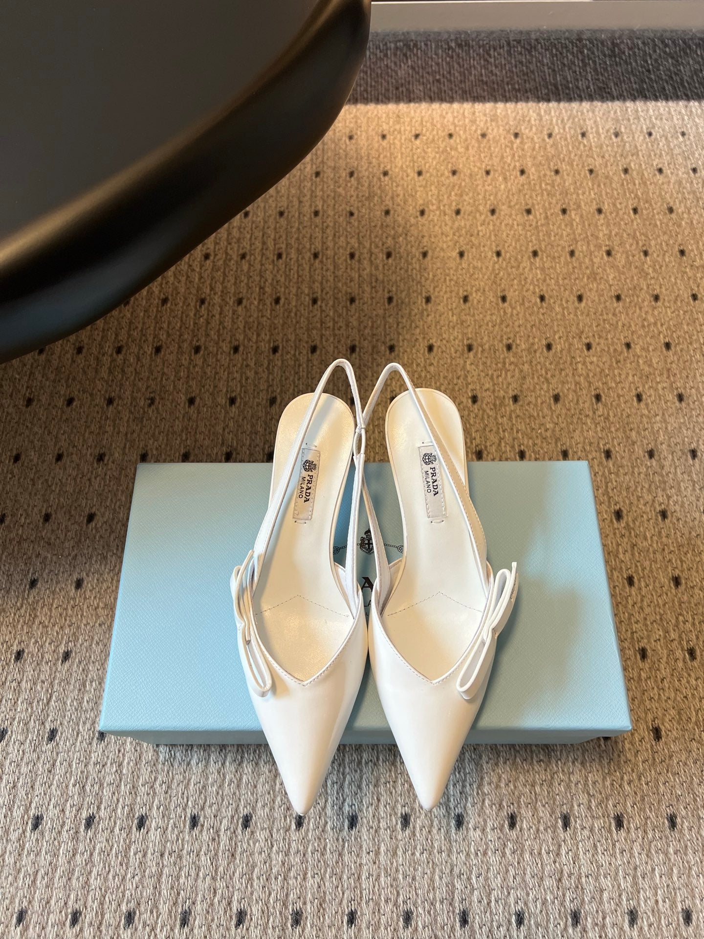 PRADA 26S BOW DETAIL SLINGBACK PUMPS 55MM IN WHITE PATENT CALFSKIN