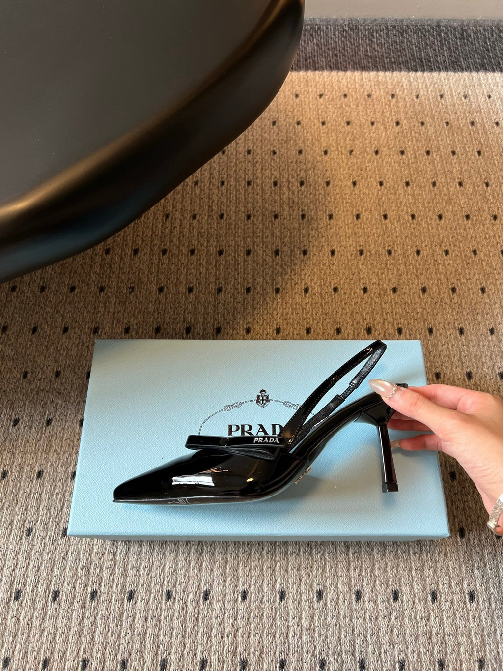 PRADA 26S BOW DETAIL SLINGBACK PUMPS 75MM IN BLACK PATENT CALFSKIN