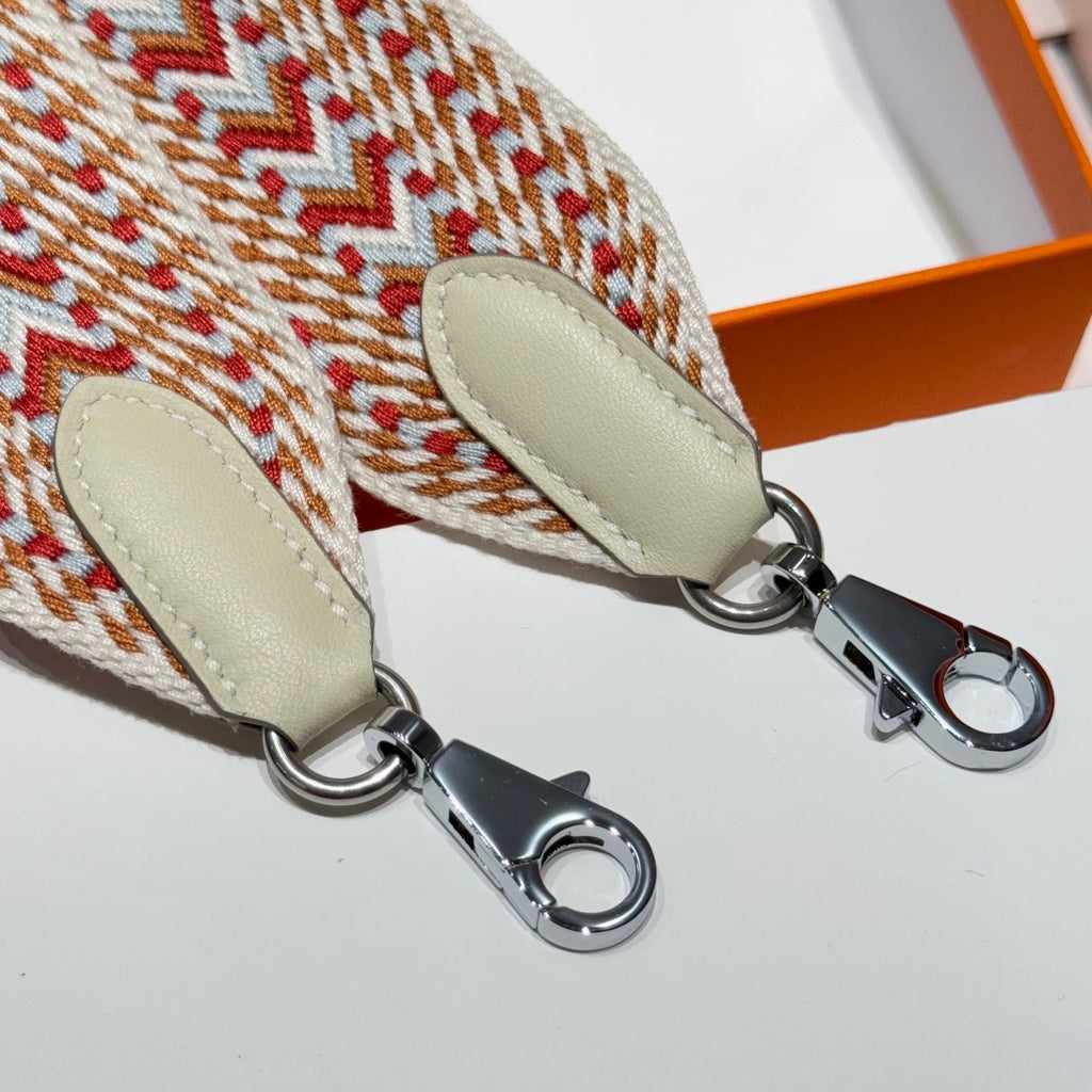 25S HERMES BAG STRAP ORANGE AND RED PATTERN 85 IN CANVAS SILVER HARDWARE