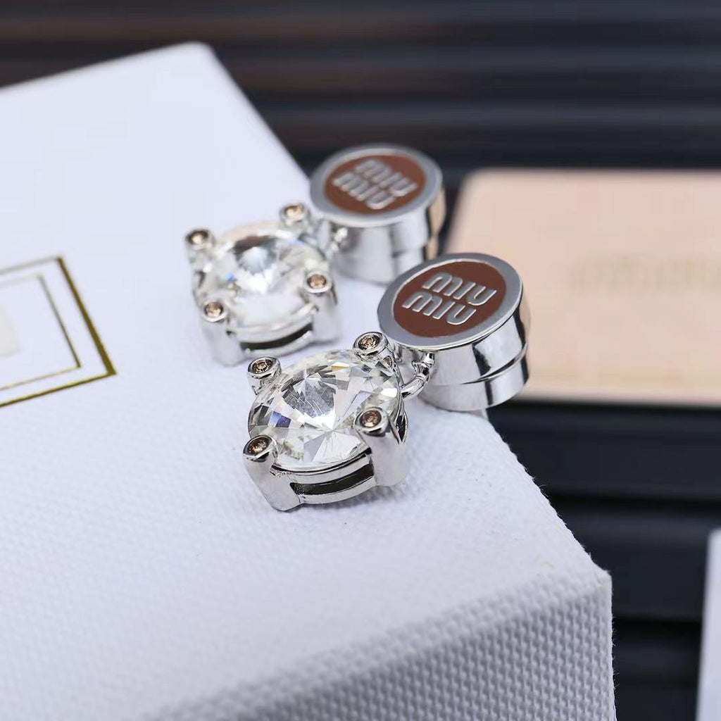 MIUMIU 26S CRYSTAL DROP LOGO STUD EARRINGS IN SILVER TONE METAL 626892