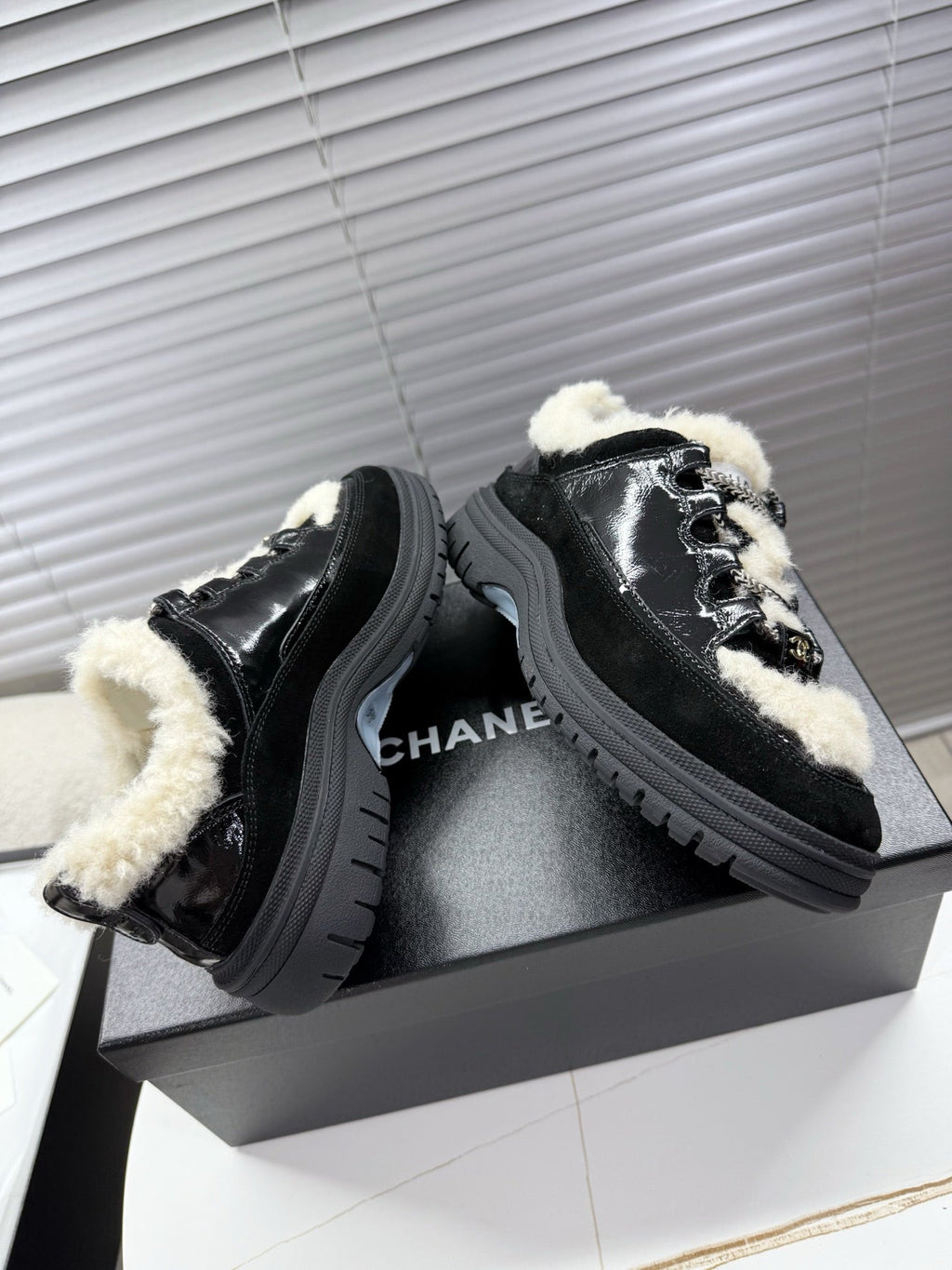 CHANEL 25S SNEAKERS WITH FUR ACCENTS 35MM IN BLACK CALFSKIN
