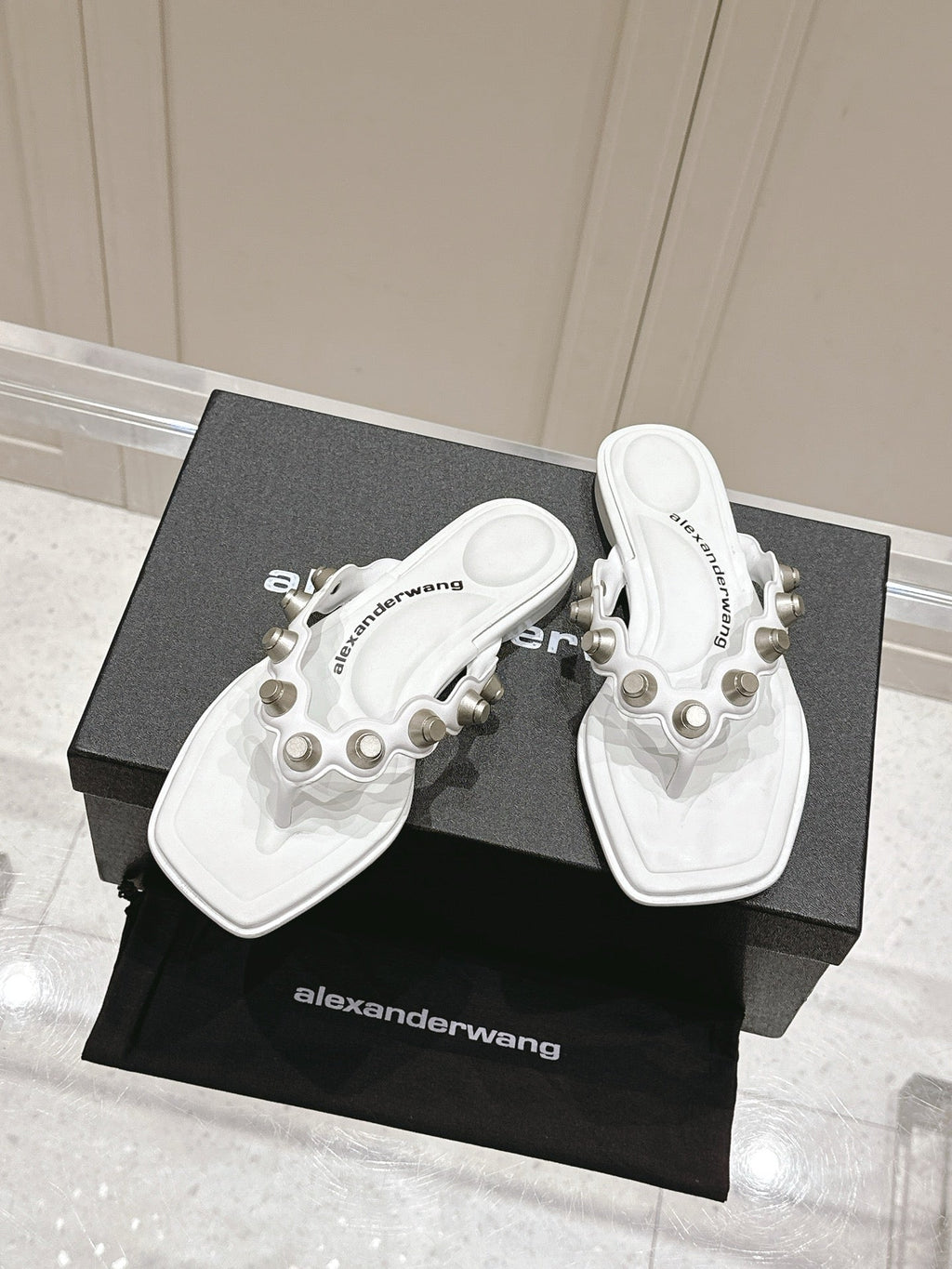 RHODES STUDDED THONG SANDALS IN WHITE CALFSKIN