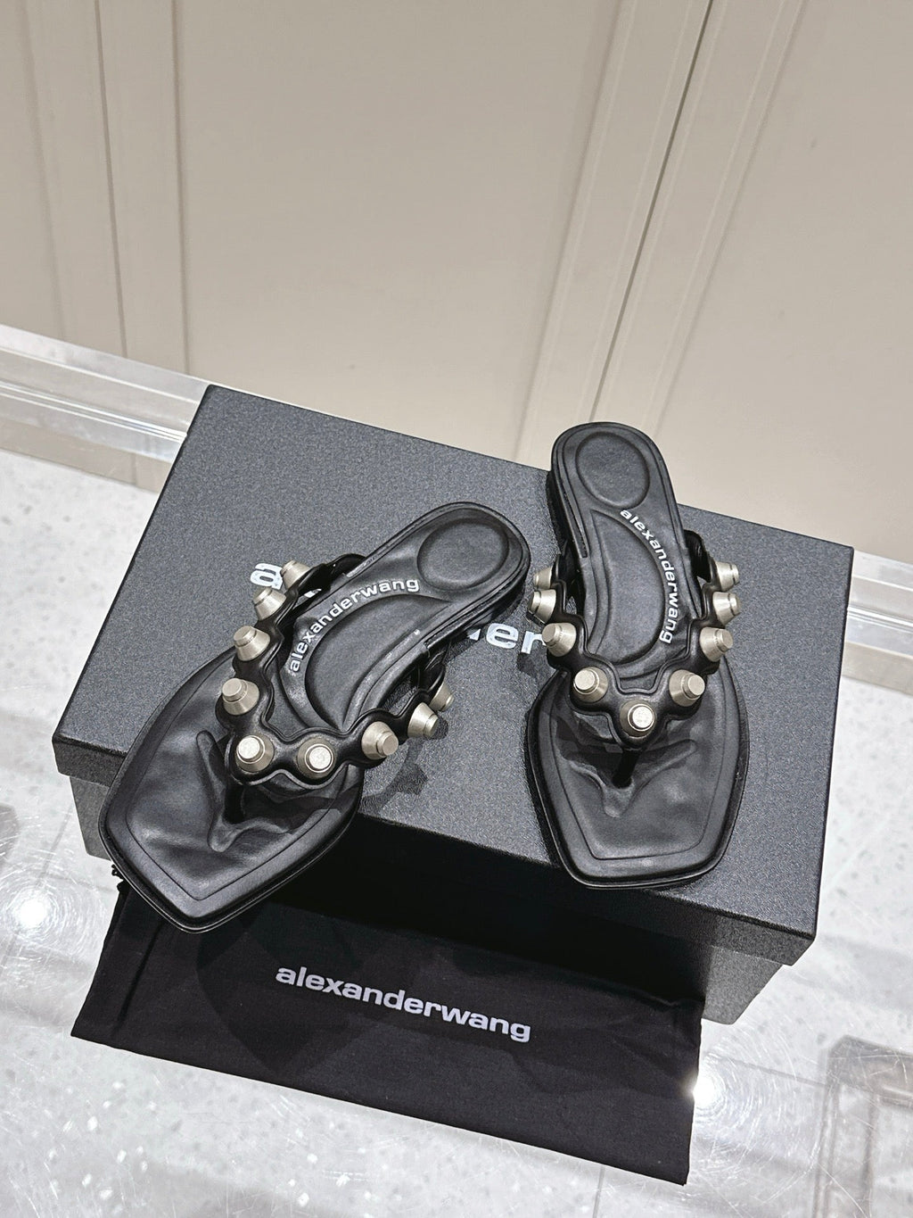 RHODES STUDDED THONG SANDALS IN BLACK CALFSKIN