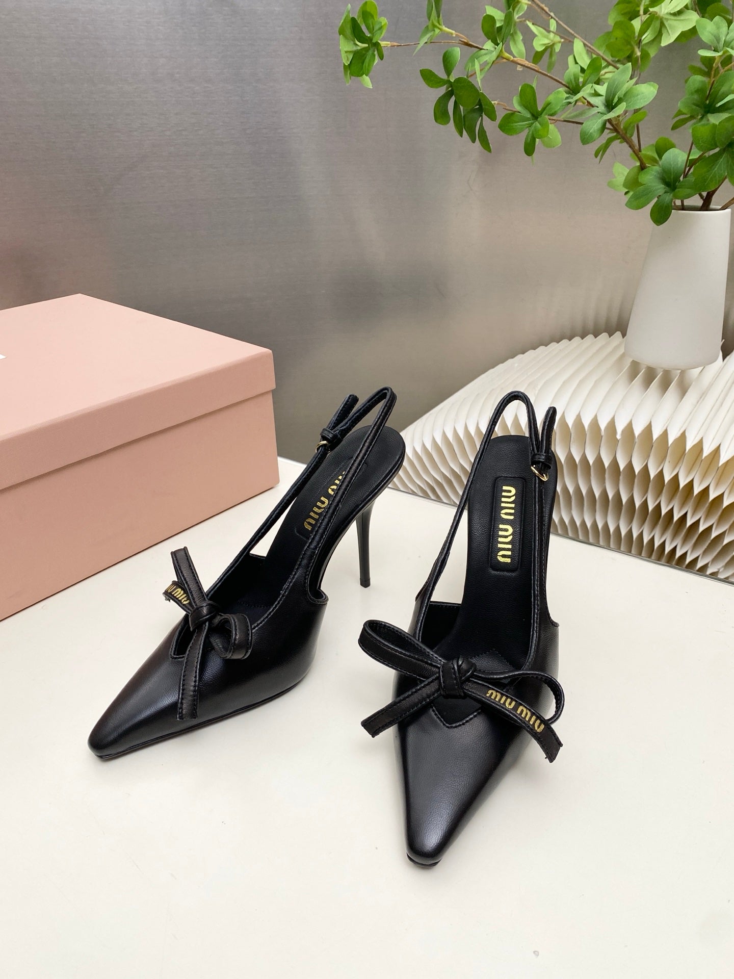 MIUMIU 26S SLINGBACK PUMPS 105MM IN BLACK CALFSKIN WITH BOW