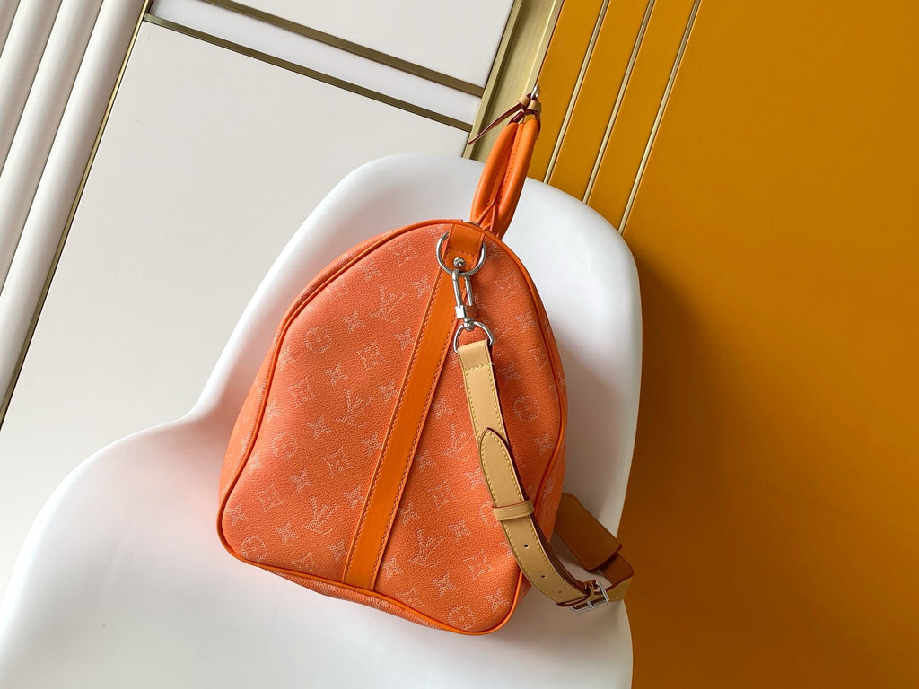LV 26S KEEPALL 50 IN ORANGE MONOGRAM CANVAS