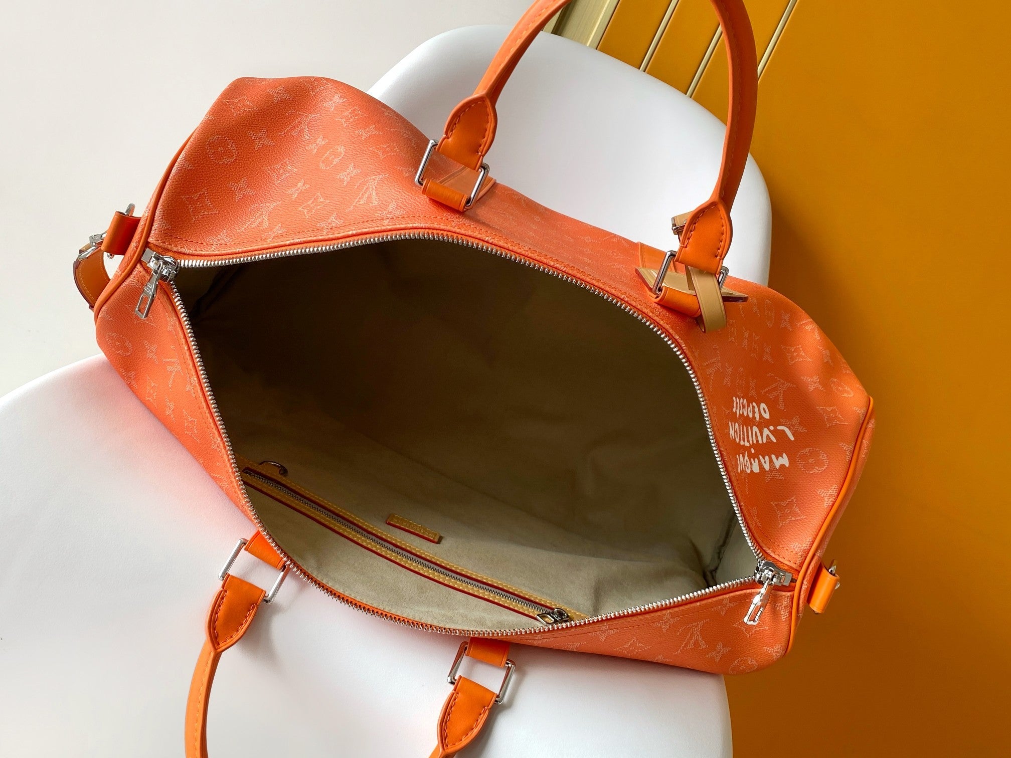 LV 26S KEEPALL 50 IN ORANGE MONOGRAM CANVAS