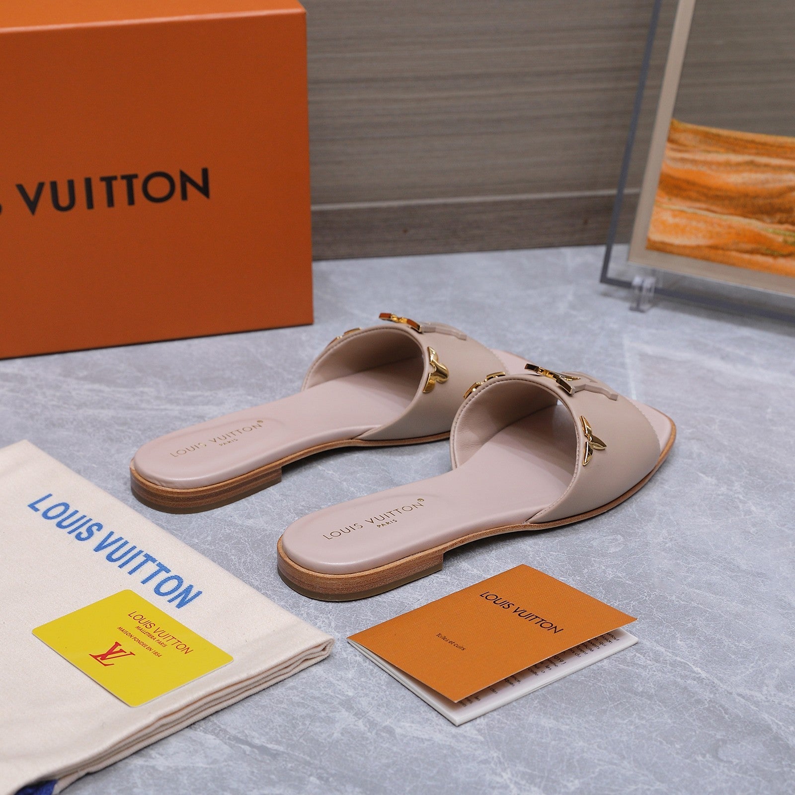LV 26S FLAT SLIDE SANDALS IN NUDE PINK CALFSKIN GOLD HARDWARE