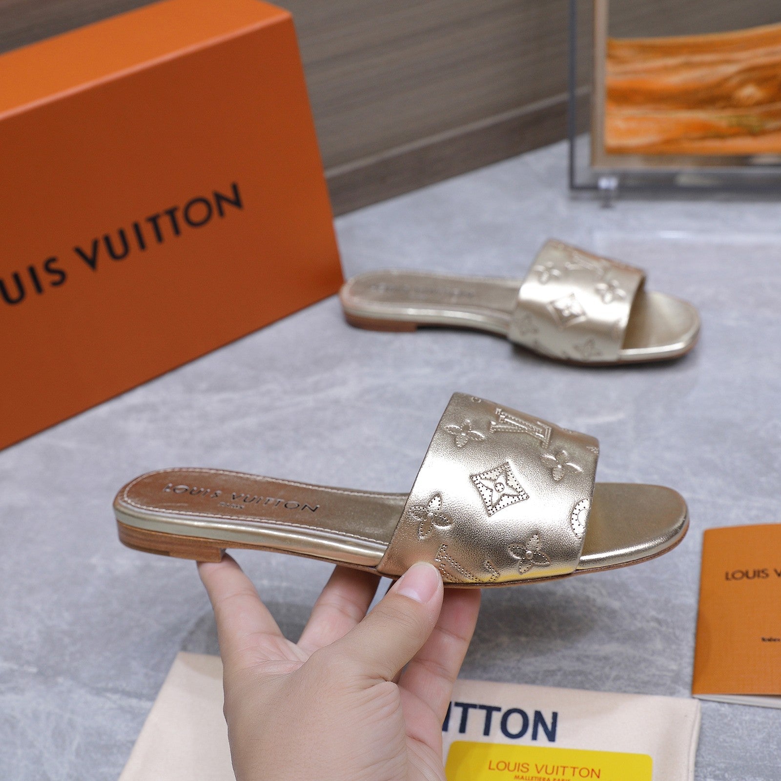LV 26S FLAT SLIDE SANDALS IN GOLD CALFSKIN EMBOSSED MONOGRAM LOGO