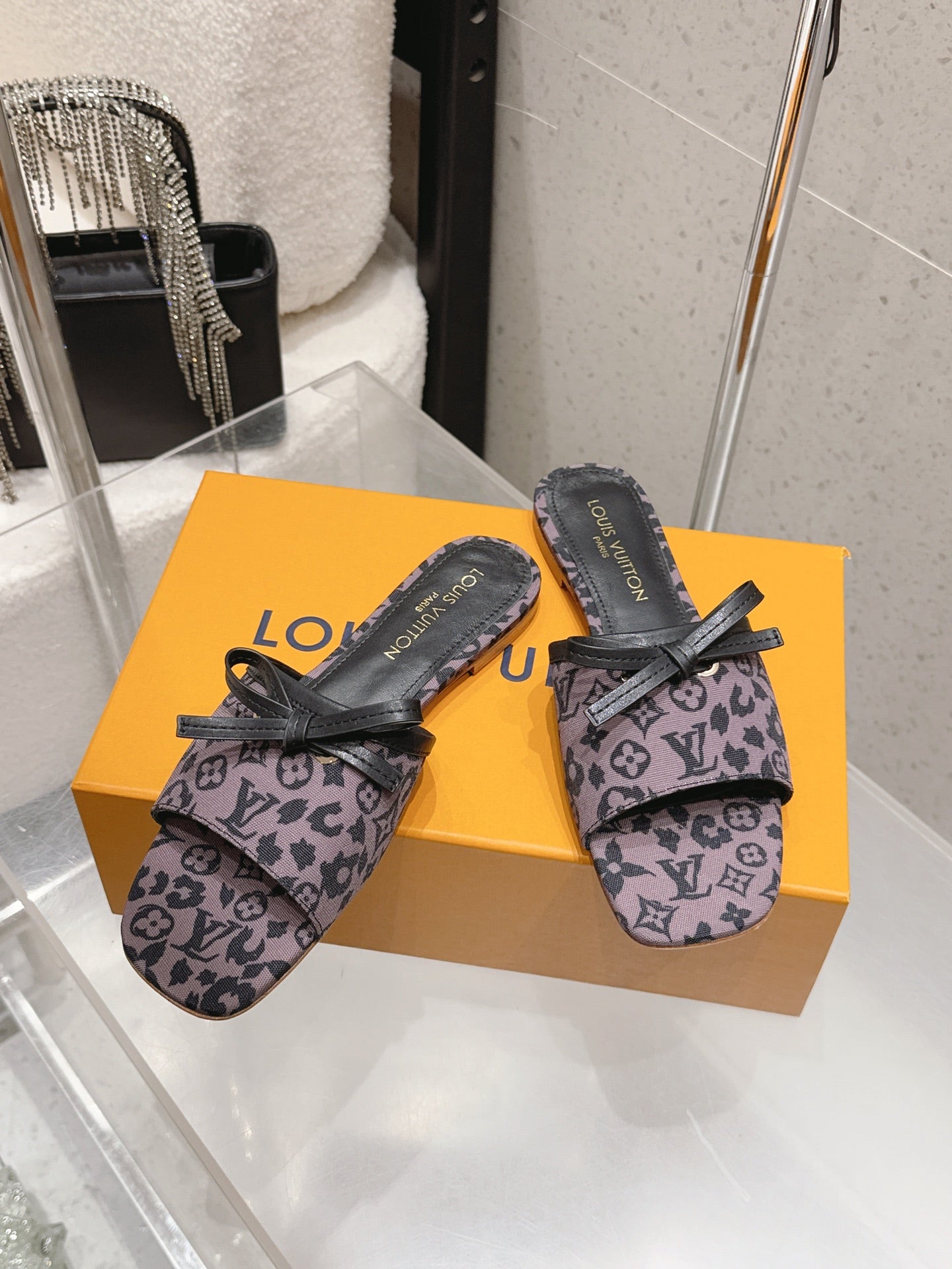 LV 26S FLAT MULE SANDALS IN PURPLE BLACK MONOGRAM CANVAS WITH CALFSKIN BOW