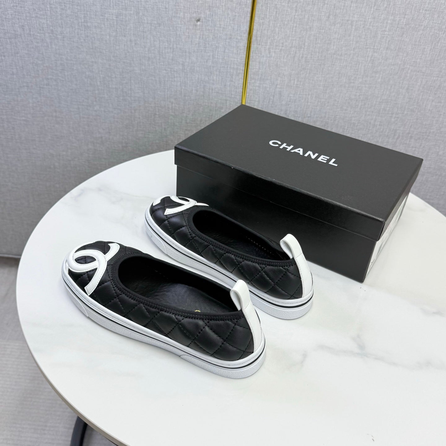 CHANEL 26S CC LOGO SLIP-ON SNEAKERS IN BLACK CALFSKIN