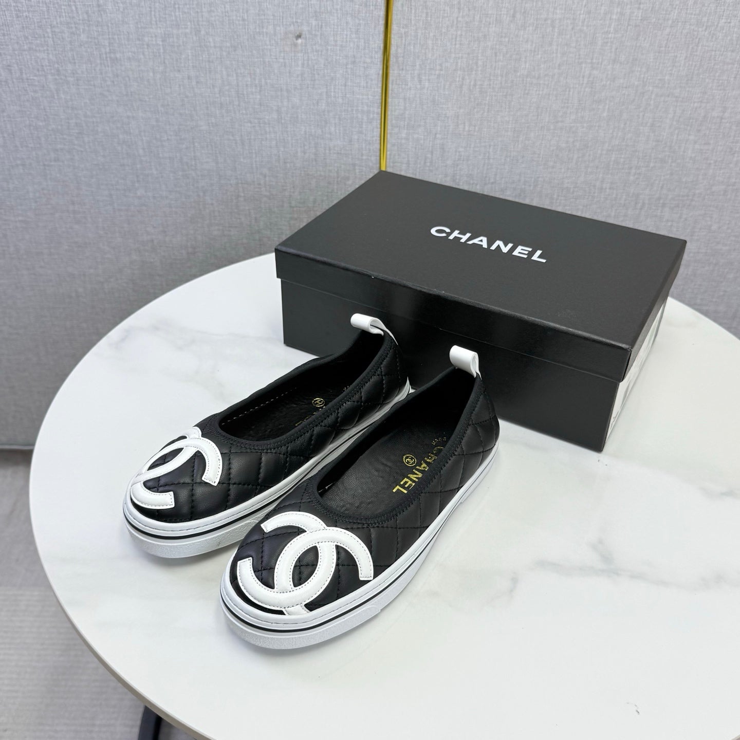 CHANEL 26S CC LOGO SLIP-ON SNEAKERS IN BLACK CALFSKIN