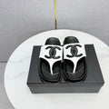 CHANEL 26S CC THONG SLIDES IN WHITE AND BLACK LAMBSKIN