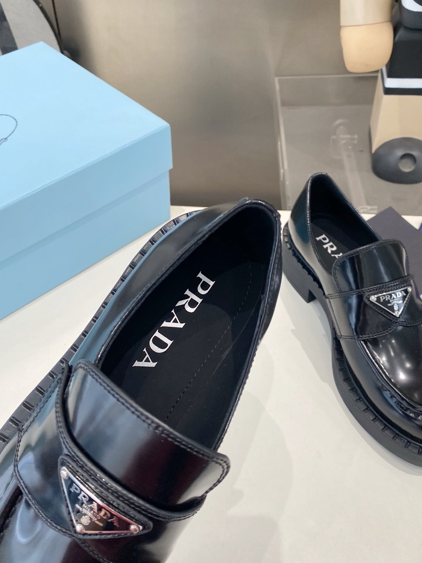 PRADA 26S LOAFERS IN BLACK CALFSKIN WITH LOGO SILVER HARDWARE