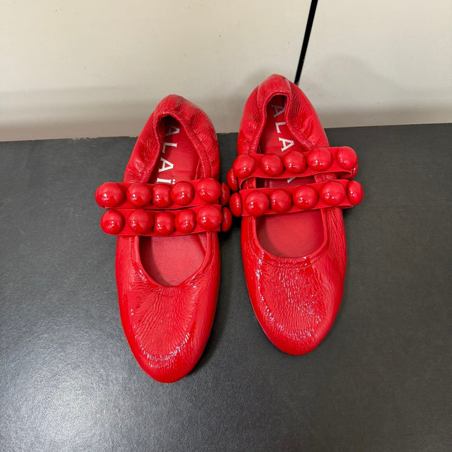 ALAIA SPHERE BALLET FLATS IN CHERRY RED LAMBSKIN