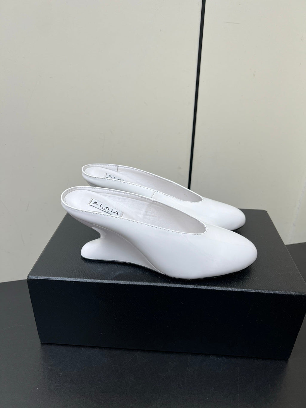 ALAIA WEDGE MULES 25S IN CREAM WHITE LAMBSKIN