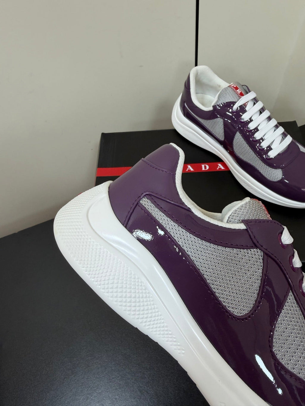 PRADA 26S SNEAKERS IN PLUM PURPLE PATENT CALFSKIN AND WHITE MESH