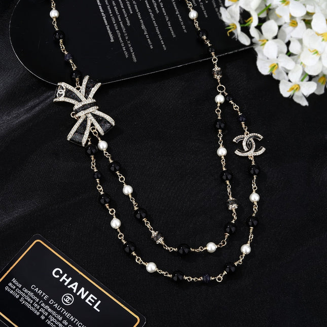 CHANEL 25S CHAIN BELT IN BLACK AND WHITE PEARL 614285