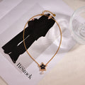 CD 26S PEARL STAR LOGO PENDANT NECKLACE IN GOLD TONE METAL